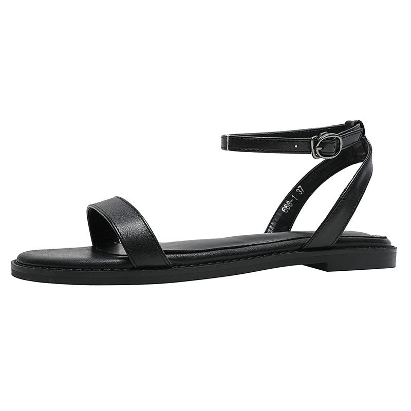 Un Mot Avec Des Sandales Plates Chaussures