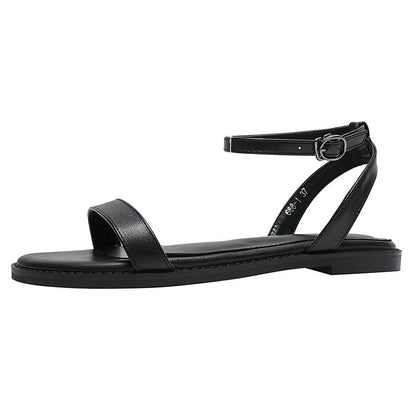 Un Mot Avec Des Sandales Plates Chaussures
